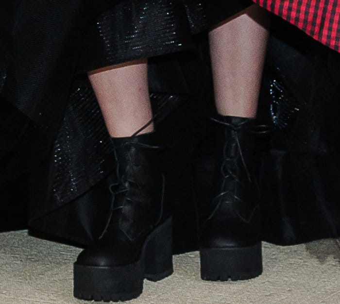 Lena Dunham wearing a custom Elizabeth Kennedy gown and Jeffrey Campbell lace-up boots at the 2017 Met Gala