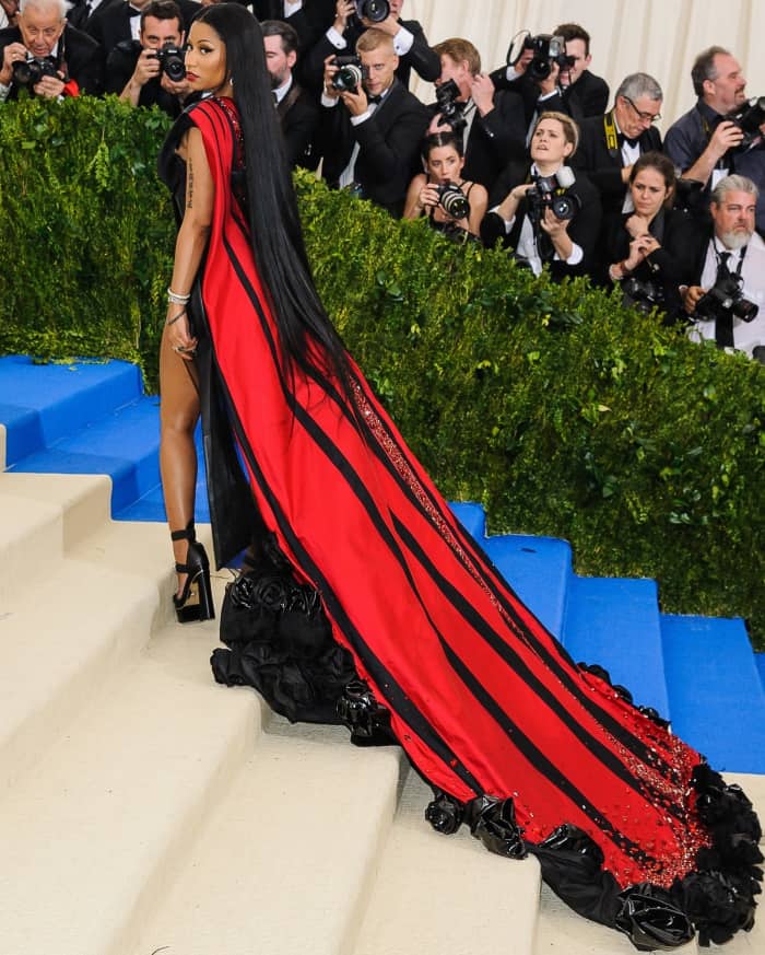 Nicki Minaj wearing a custom H&M gown and Versace "Medusa" platform sandals at the 2017 Met Gala