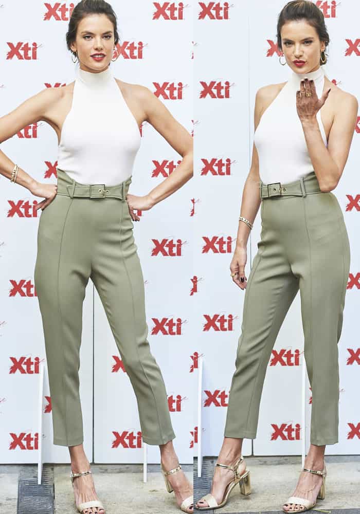 The leggy model posed for the cameras in a pair of Elisabetta Franchi trousers