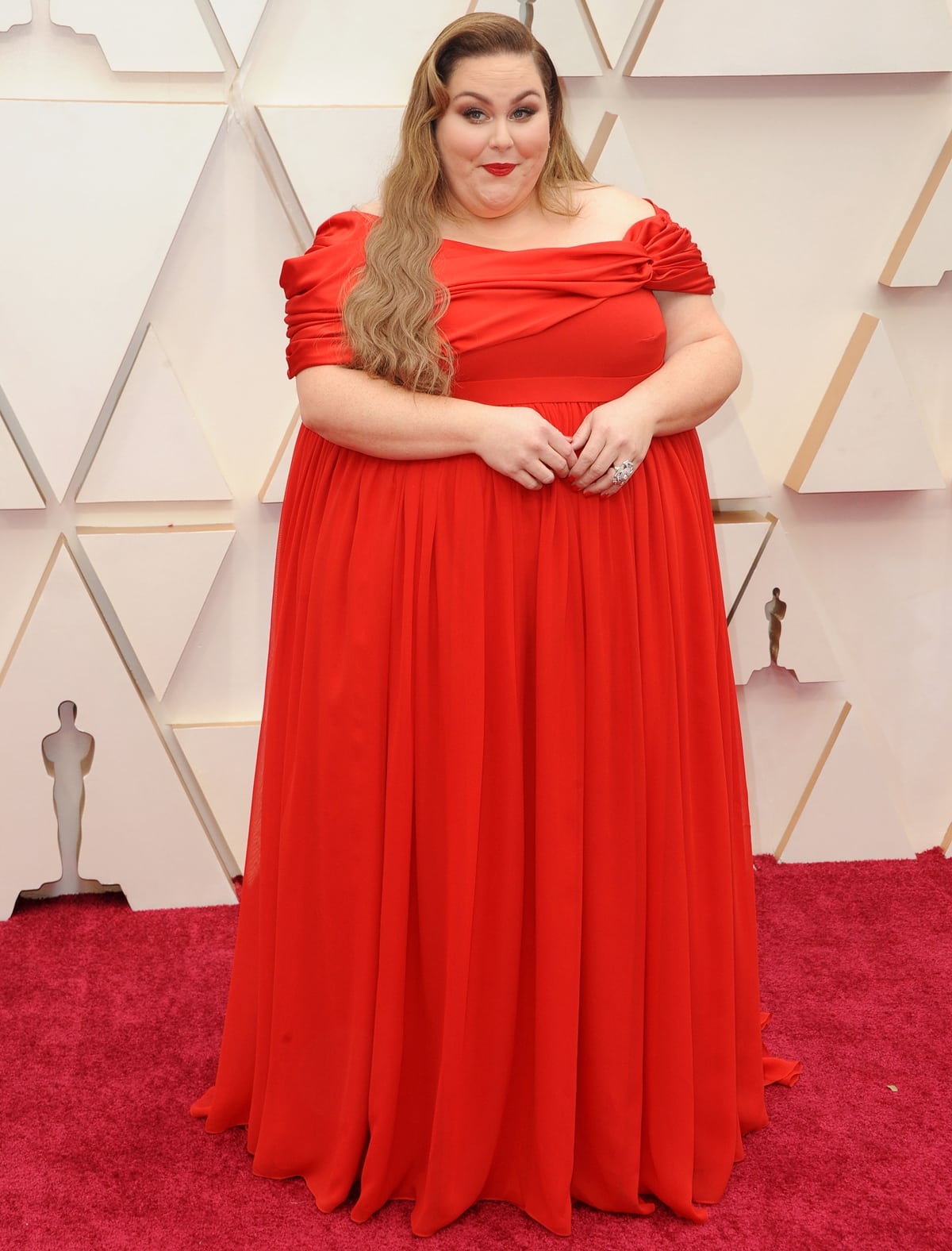 Chrissy Metz in a red off-the-shoulder dress by Christian Siriano at the 92nd Annual Academy Awards