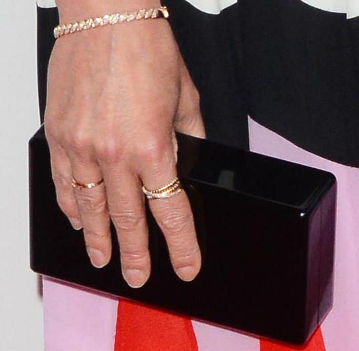 Cobie Smulders squeezes in a bit of structure into her look with an Edie Parker "Jean" clutch