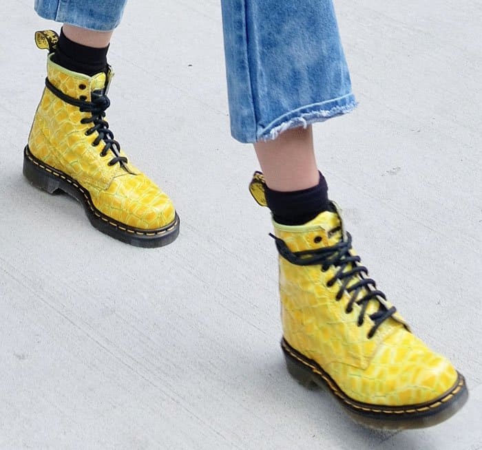 Gigi Hadid styled her cut off jeans with yellow Dr. Martens boots