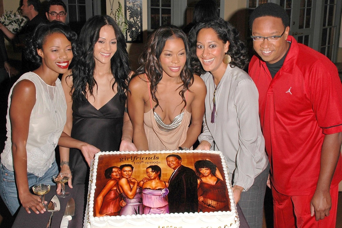 The cast of Girlfriends, including Jill Marie Jones, Persia White, Golden Brooks, Tracee Ellis Ross, and Reggie Hayes, celebrating the show's 100th episode