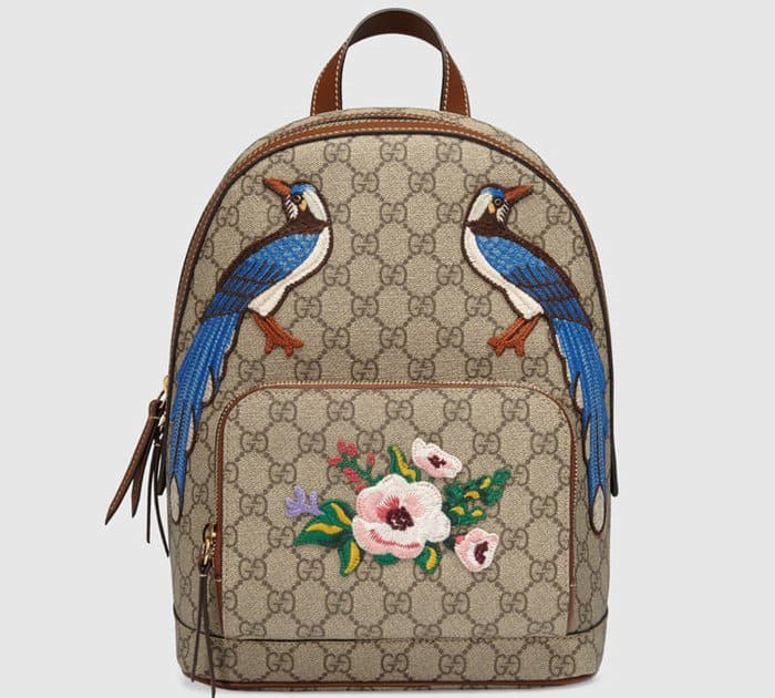 The Gucci Garden The Souvenir Collection Backpack is decorated with lovely blue birds and a flower on its zip pocket.