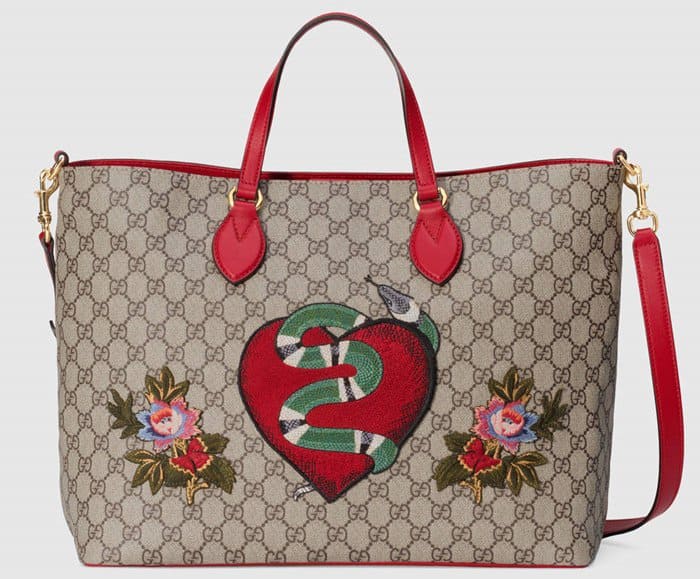 The Gucci Limited Edition soft GG Supreme tote features a snake and flowers design.