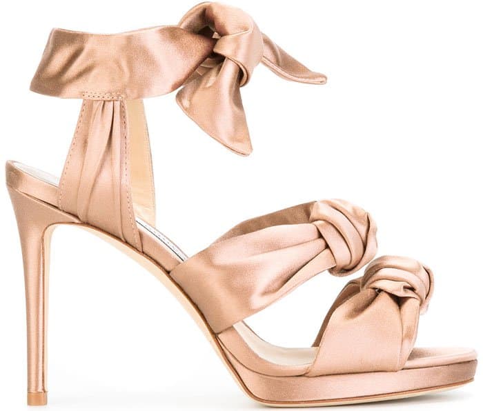 Blush satin Jimmy Choo Kris 120 platform sandals with knot accents at uppers, covered heels, and tie closures at ankles