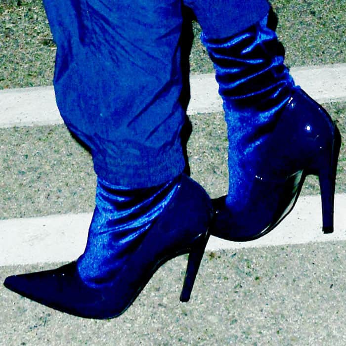 Kendall Jenner rocks striking blue velvet stiletto boots with a pointed toe