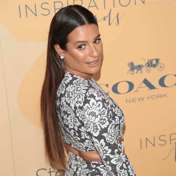 Lea Michele complements her sleek, straight hairstyle with minimalistic white stud earrings