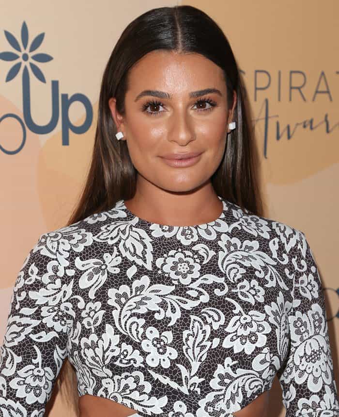Lea styled her lacy Michael Kors dress with white stud earrings