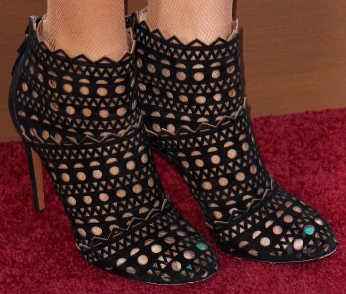 Paris Hilton kept the theme going with her Alaia laser cutout booties