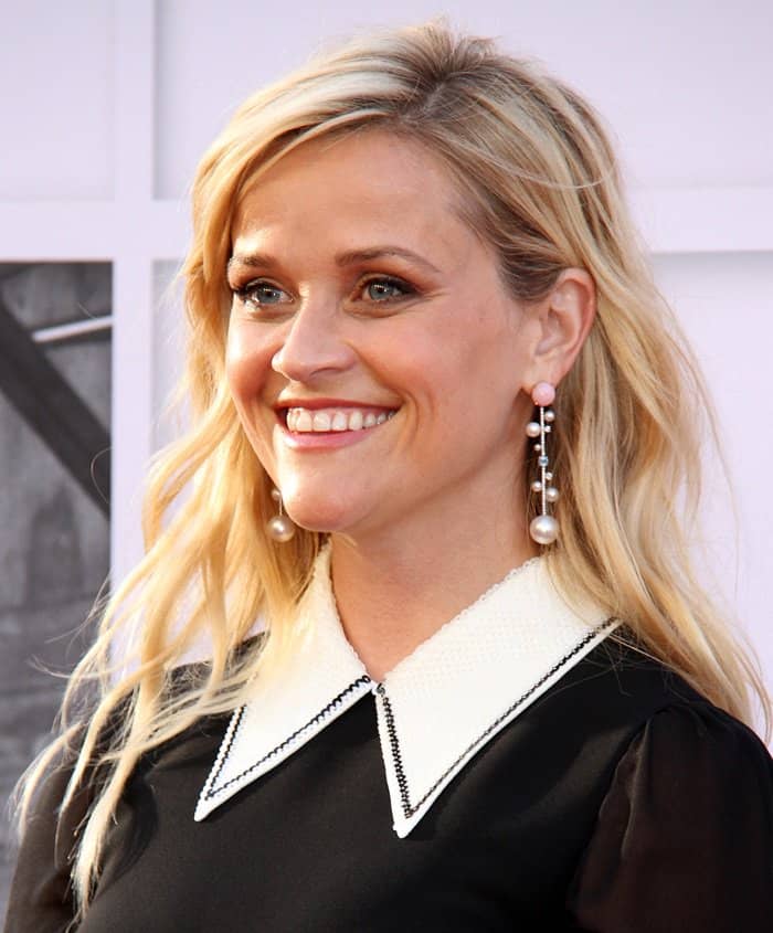 Reese walked in with a big smile as she posed on the red carpet