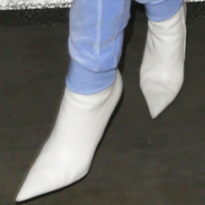 Rihanna Removes Balenciaga Boots For Airport Security