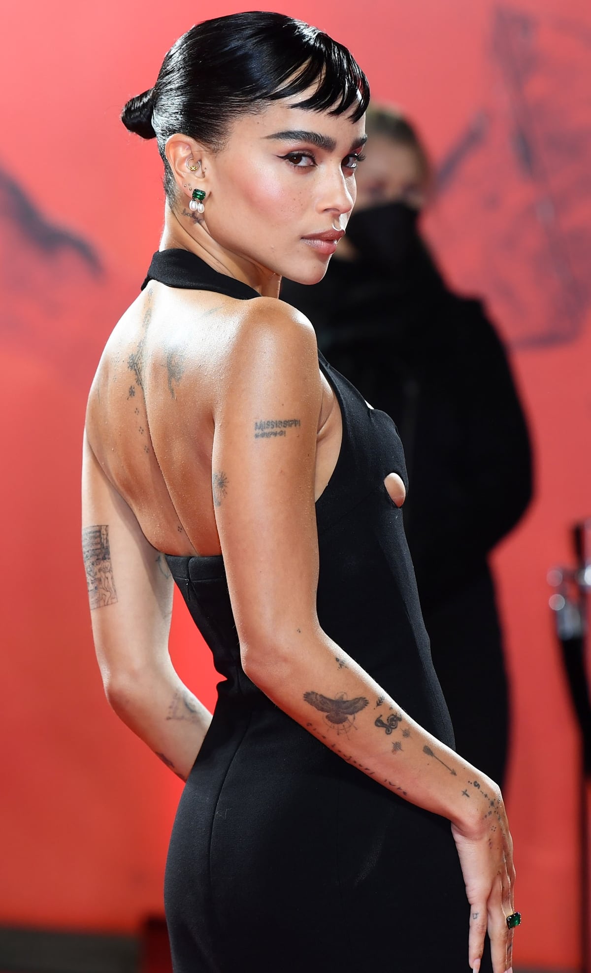 Zoë Kravitz channeled her Catwoman character and displayed her body tattoos on the red carpet