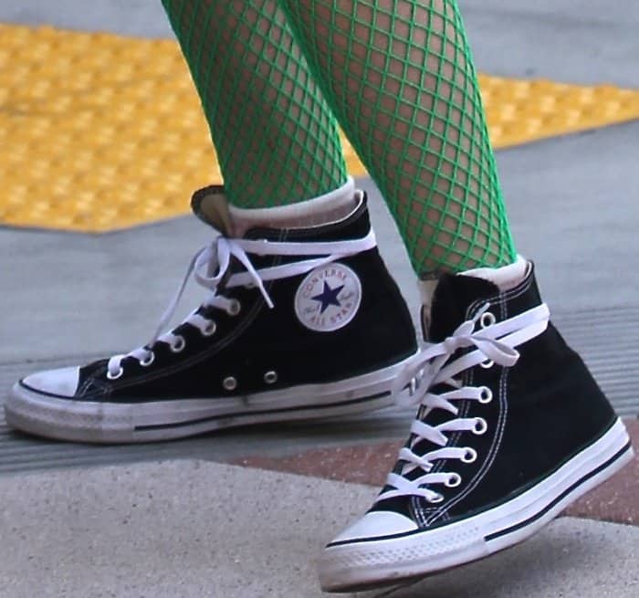 Bella Thorne wearing Converse Chuck Taylor All Star high top sneakers while out and about in LA