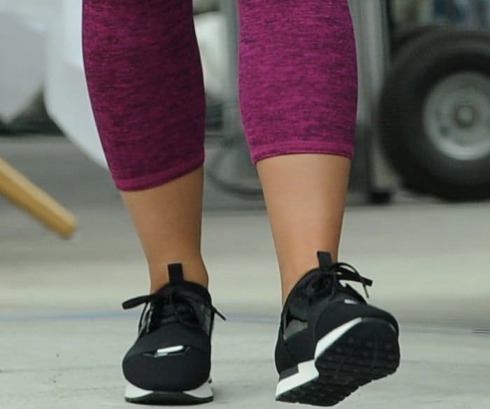Demi Lovato wears black-and-white sneakers on the set of the latest Fabletics commercial