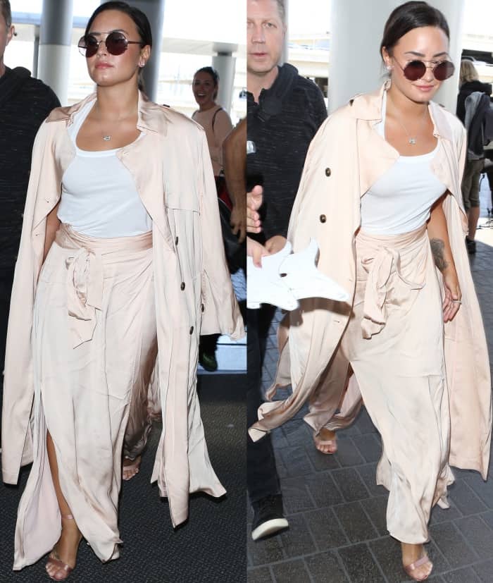 Demi Lovato wearing an ATM tank top, Elizabeth and James coat and skirt, and Gianvito Rossi "Portofino" sandals in blush satin