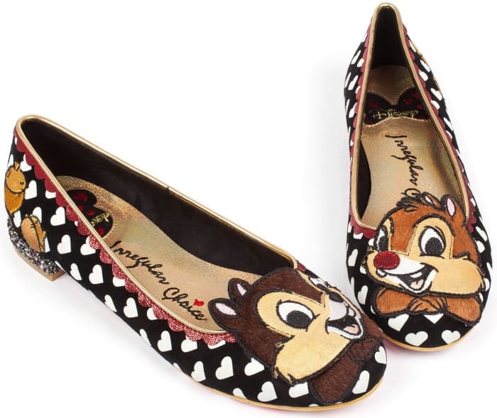 These flats have leather uppers, red scallop details, acorn prints, and all-over printed hearts