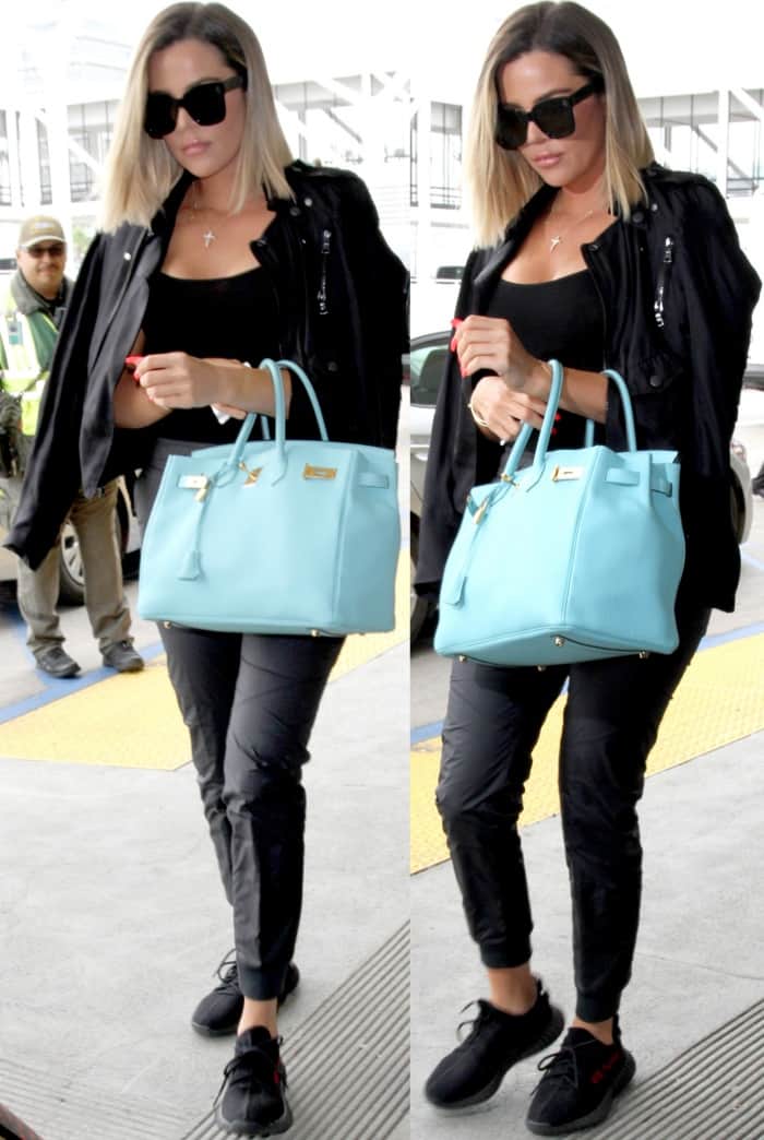 Khloe Kardashian in a low-cut top tucked into cropped sweatpants