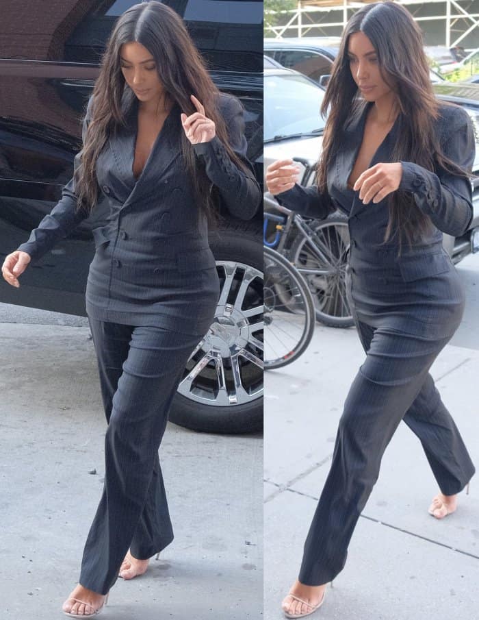 Kim Kardashian wearing a vintage Jean Paul Gaultier suit and Yeezy sandals in New York City