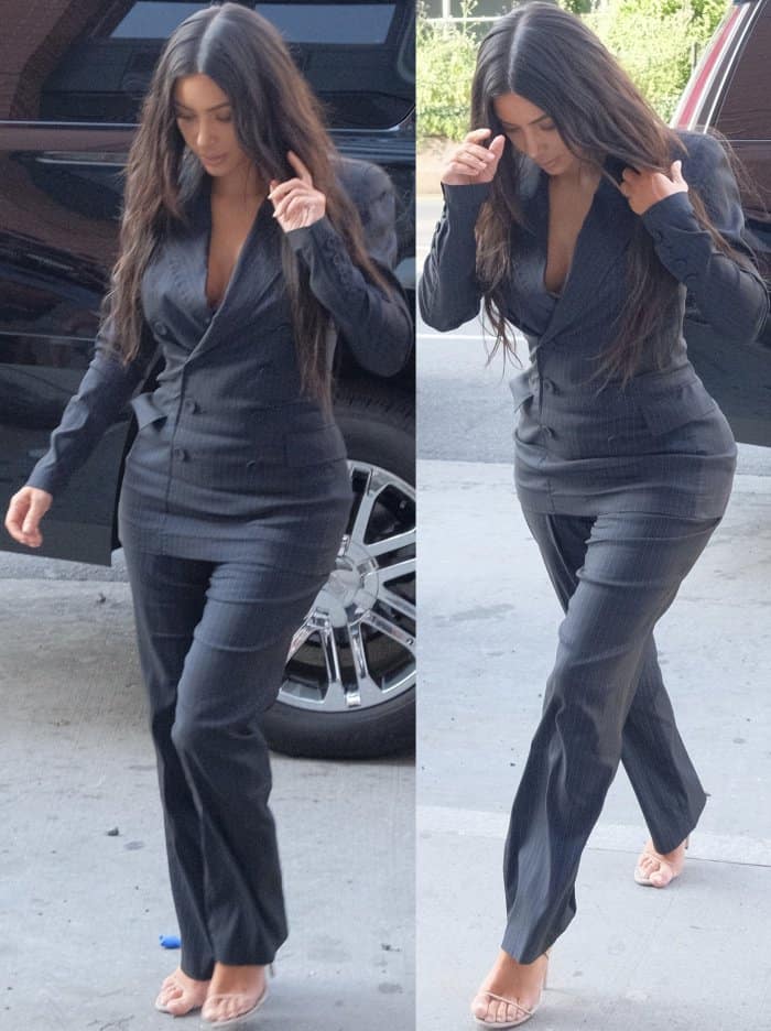 Kim Kardashian wearing a vintage Jean Paul Gaultier suit and Yeezy sandals in New York City