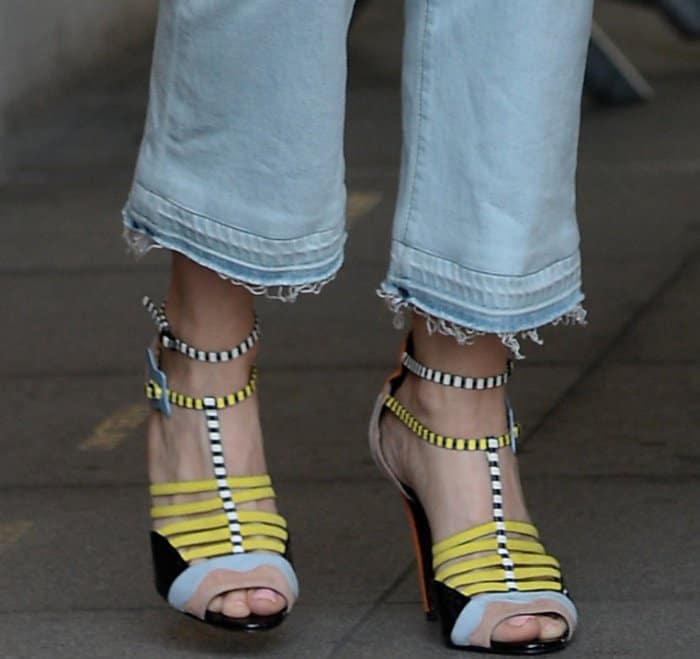 Stepping out in style: Kristen Wiig’s Pierre Hardy 'Alchimia' sandals, featuring bold color blocks and distinctive cloud buckles, steal the spotlight