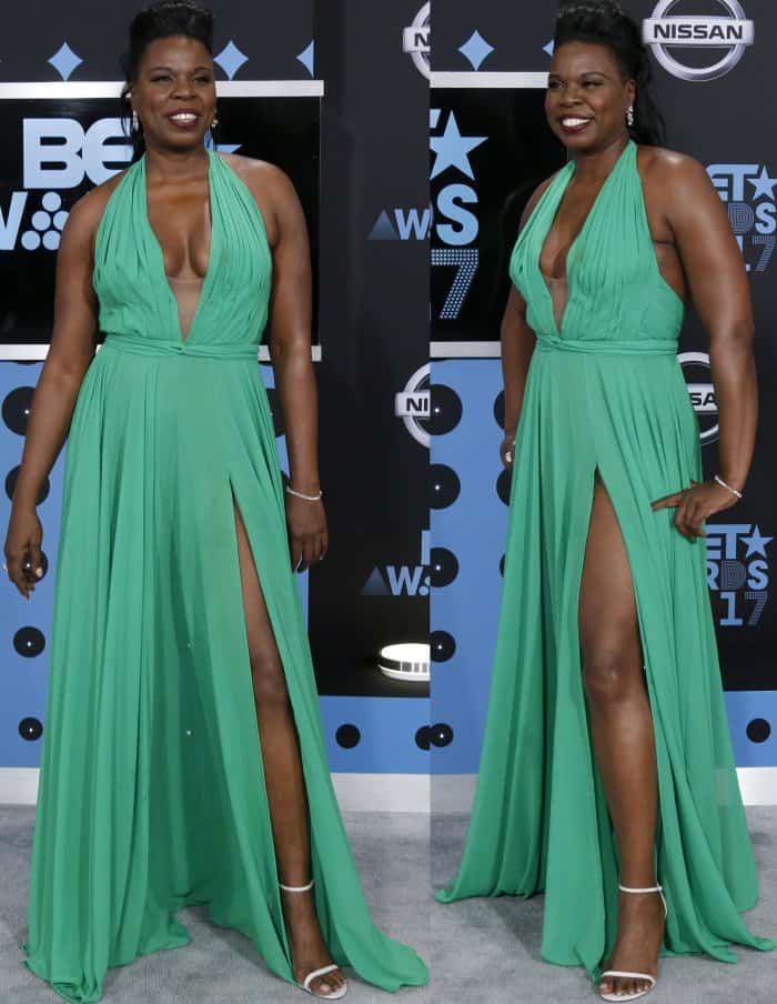 Leslie Jones wearing a custom Stello dress and white Stuart Weitzman ankle-strap sandals