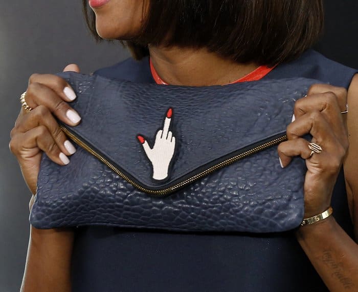 Aisha Tyler with a striking statement clutch at the LA premiere of Atomic Blonde.