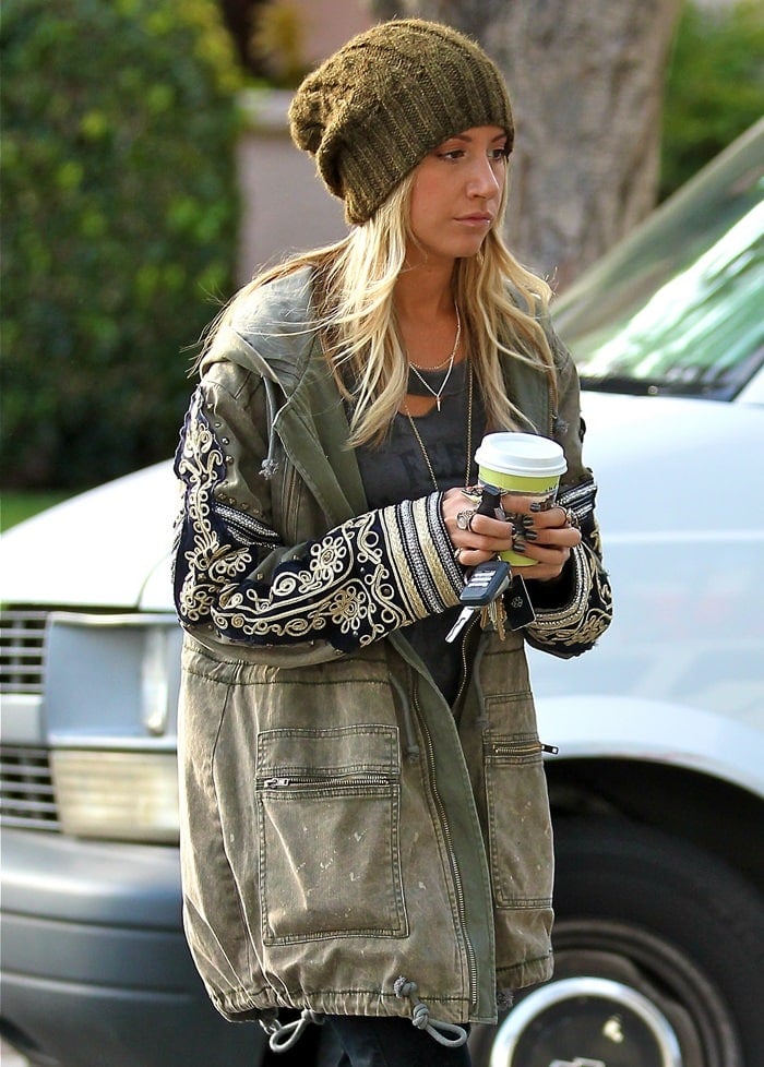 Ashley Tisdale steps out in a casual yet chic look, featuring an eye-catching oversized forest green toque, while enjoying a coffee break at Urth Caffé in West Hollywood