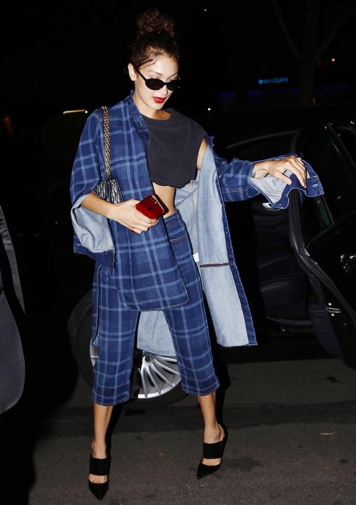 Bella Hadid in a plaid pantsuit and black leather Schutz Quereda mules