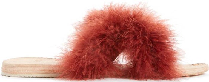 A slim slide sandal inspired by traditional Kenyan footwear gets a lavish update in fluffy, richly colored feathers