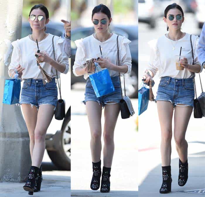 Lucy Hale runs errands in Los Angeles on July 8, 2017 in denim shorts and a white top