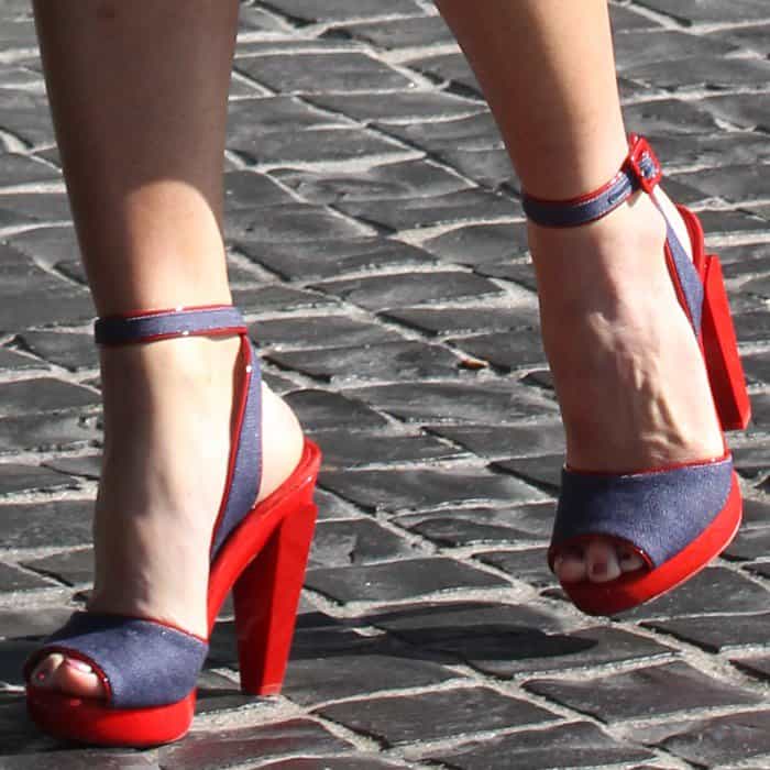 Olivia Munn wearing a pair of Christian Louboutin 'Soclo' denim red sandals