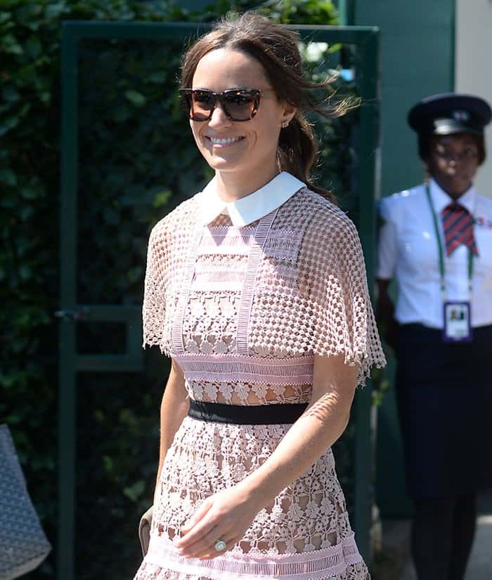 Pippa Middleton paired her sheer lace dress with oversized cat eye sunglasses.