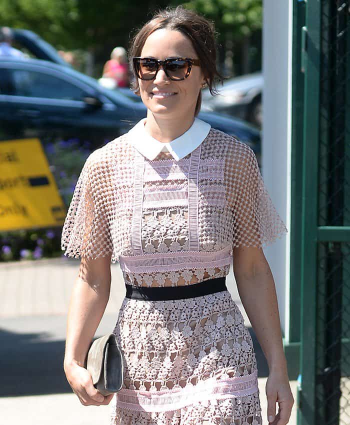 Pippa Middleton carrying a gray clutch with her sheer lace dress at Wimbledon.