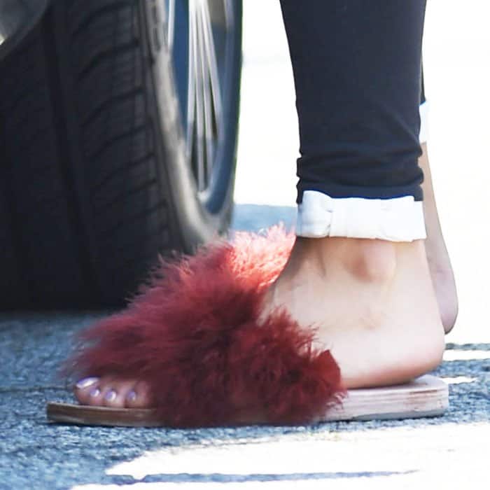 Vanessa Hudgens follows the fur slide trend with her yoga slippers