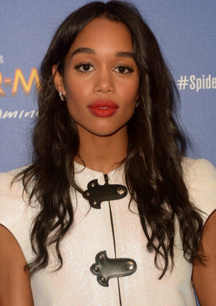 Laura Harrier wearing a white Louis Vuitton Resort 2018 ensemble and black strappy sandals at the “Spider-Man: Homecoming” First Responders’ Screening