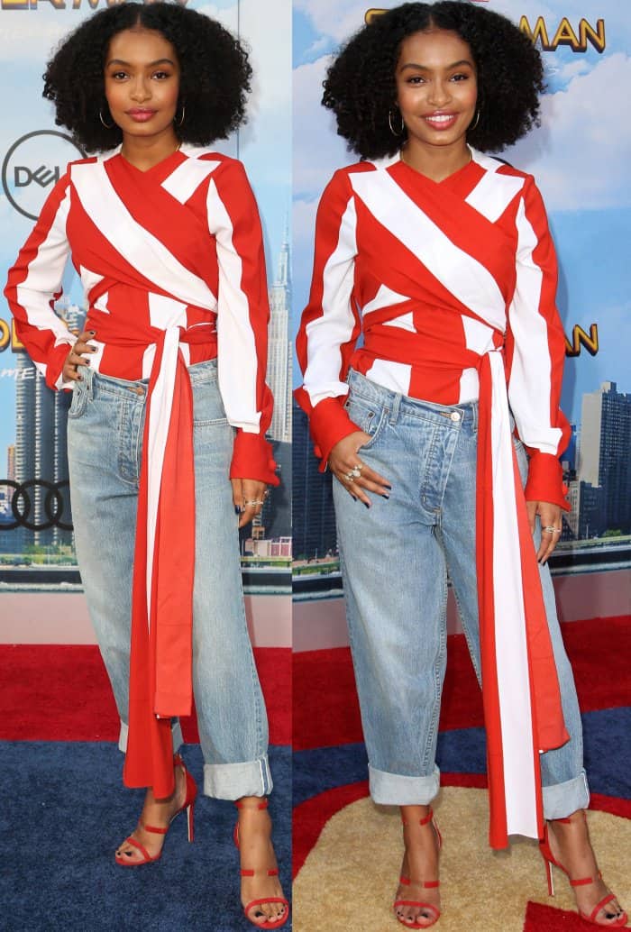 Yara Shahidi in a stretch-silk blouse with wide red-and-white stripes and wrap-around tie details on the waist