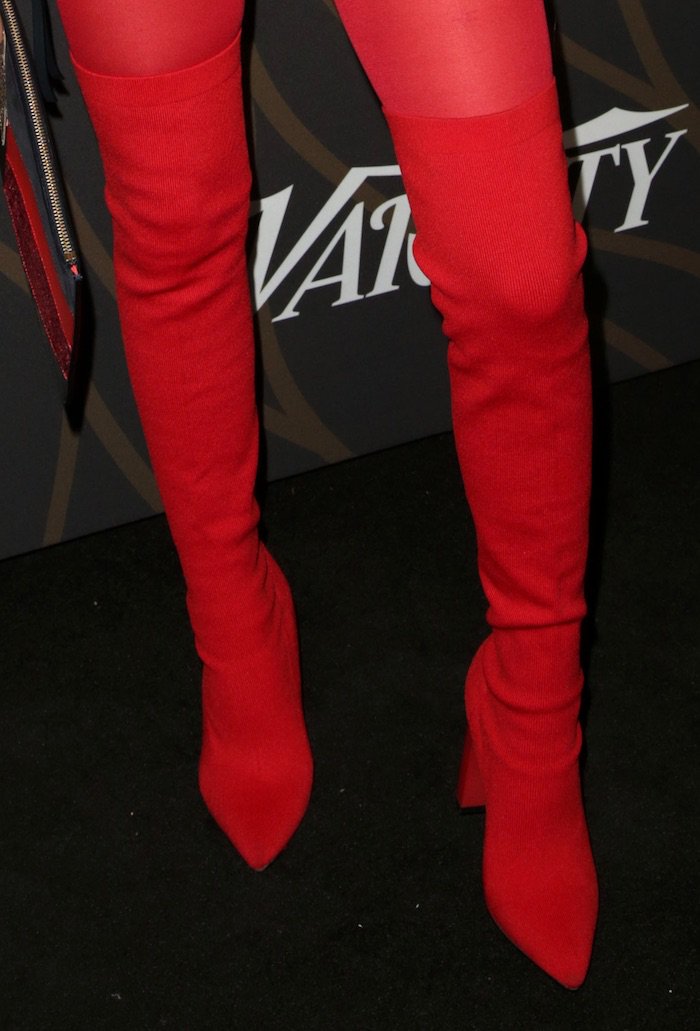 Jenna Ortega in red Tommy Hilfiger thigh-high boots