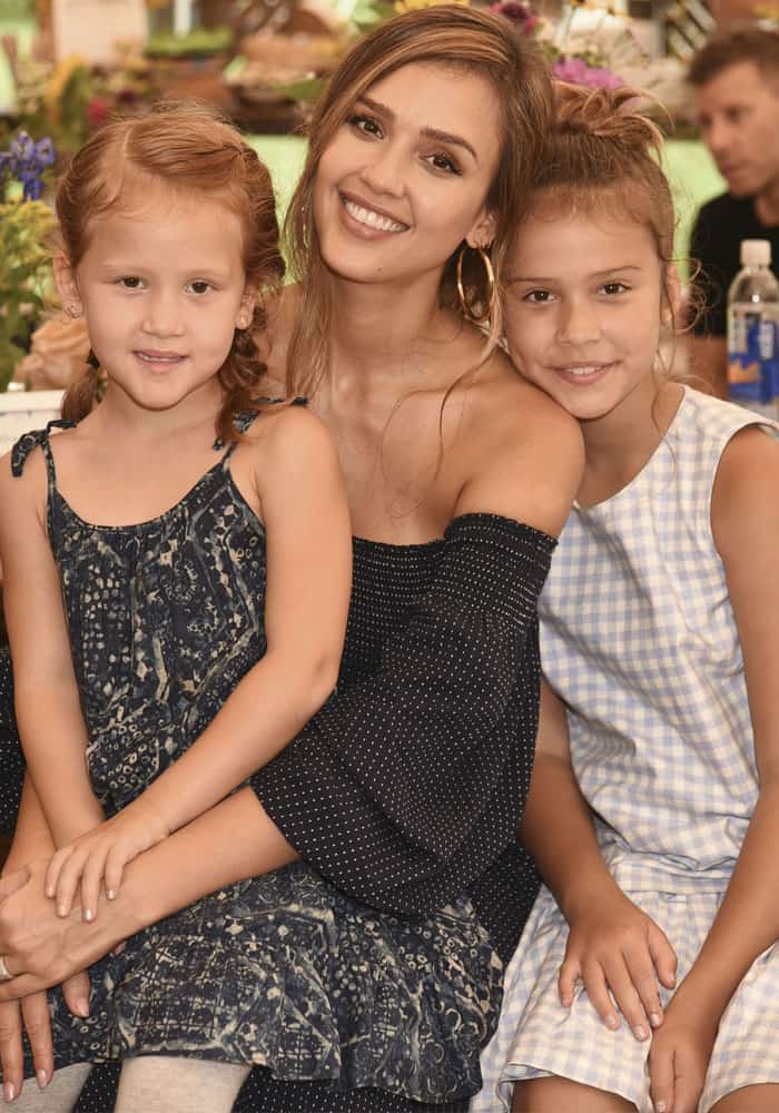 Jessica sits with her two daughters, Haven and Honor