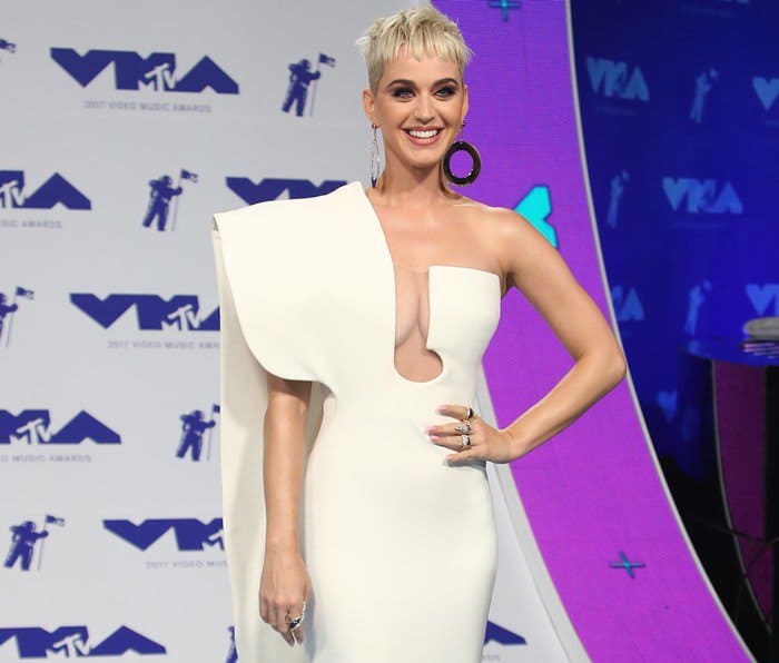 Katy Perry wearing a white one-shoulder Stéphane Rolland dress with cutout detailing at the 2017 MTV Video Music Awards held at The Forum in Inglewood, California, on August 27, 2017