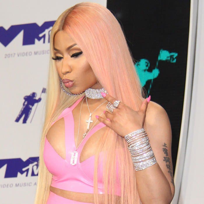 Nicki Minaj shows off her ample curves in a pink latex bodysuit from Vex Latex