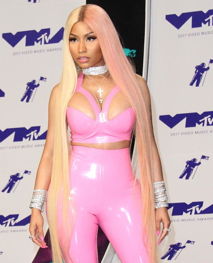 Nicki Minaj showing off her ample curves in a pink latex bodysuit from Vex Latex while walking the carpet at the 2017 MTV Video Music Awards held at The Forum on Sunday in Inglewood, California, on August 27, 2017