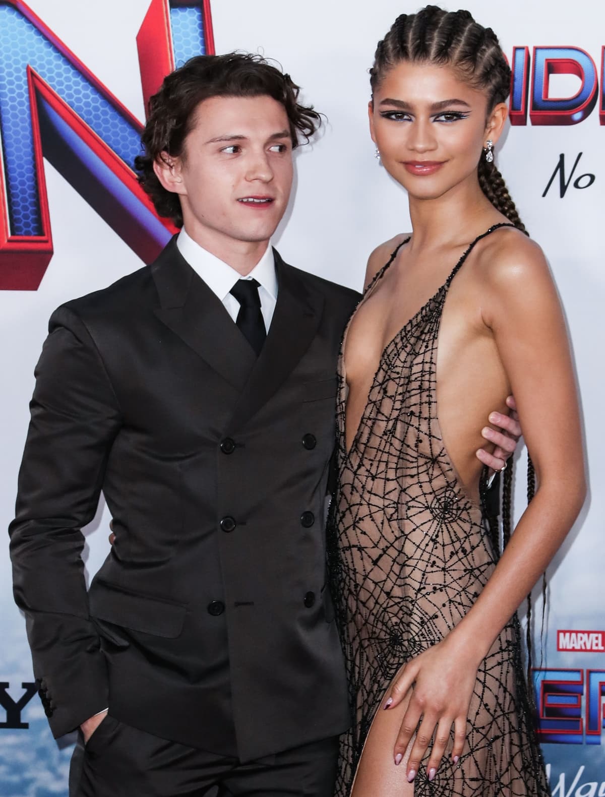 Tom Holland tries to check out Zendaya's sideboob on the red carpet
