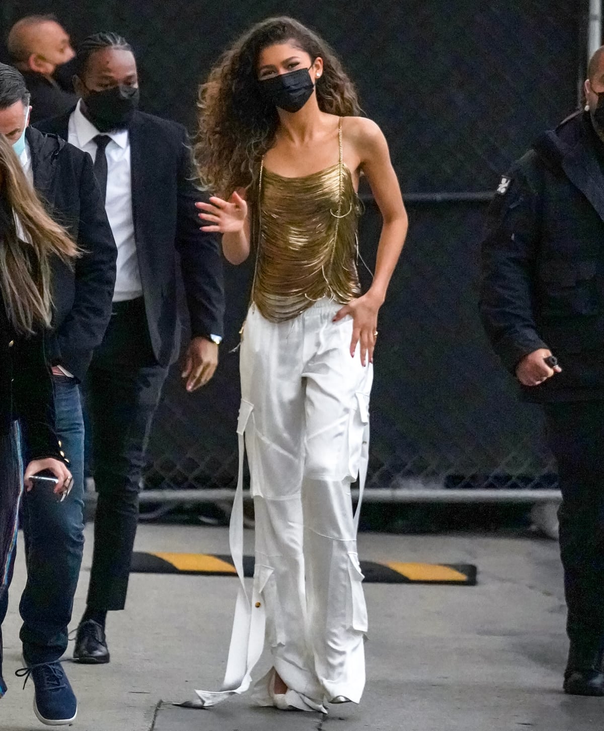 Zendaya arriving in a Balmain Spring 2022 look and white Christian Louboutin So Kate pumps for an appearance on Jimmy Kimmel Live!