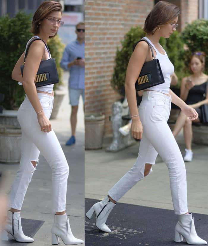 Bella Hadid wearing a Re/Done ribbed tank top, Citizens of Humanity "Liya" high-rise cropped jeans, and Topshop "Hawk" croc boots while out and about in NYC