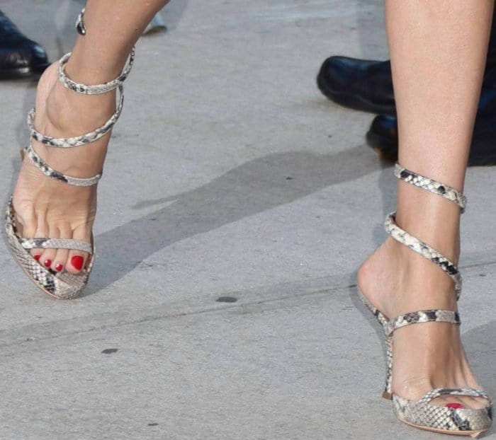 Chloë Sevigny wearing strappy snakeskin sandals at the premiere of "Good Time" in New York City