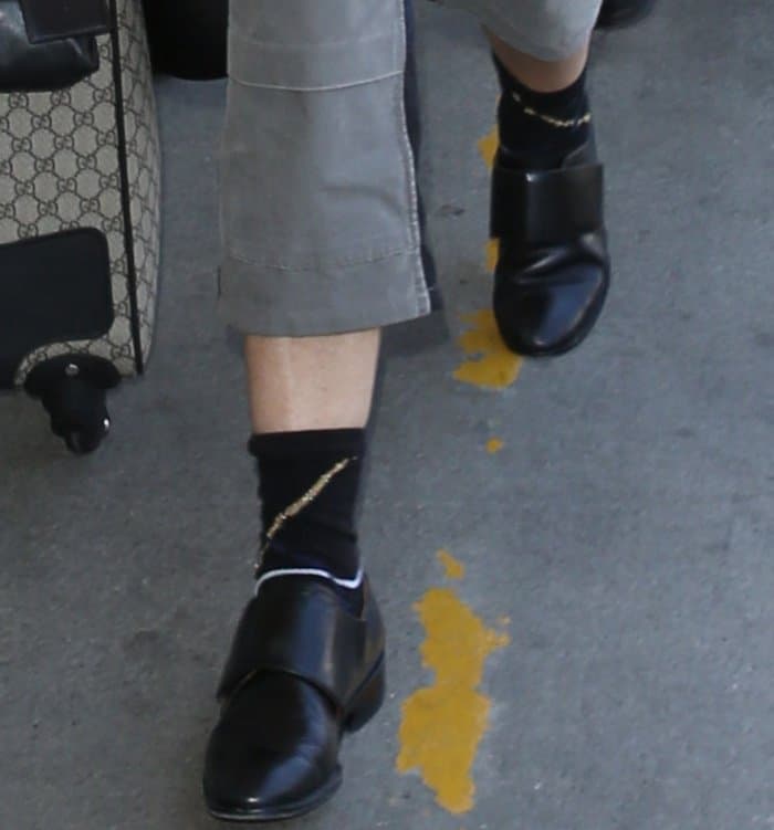 Demi Moore arriving at LAX wearing black leather slip-on shoes