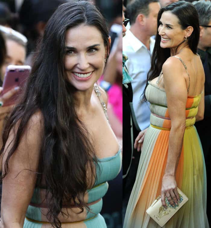 Demi Moore wearing a multicolored Christian Dior gown and toting a Dior Tarot card clutch