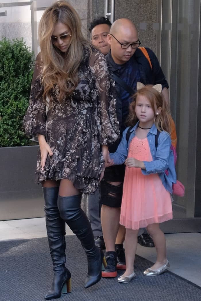 Jessica Alba steps out in a flowy floral dress and thigh-high leather boots, showcasing her effortlessly chic style in New York City