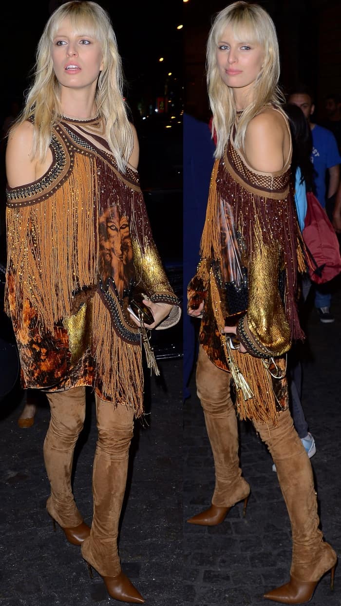 Karolina Kurkova wearing a Balmain cold-shoulder dress and brown suede legging boots at the Vogue Paris Foundation dinner